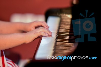 Girl Plays Piano Stock Photo