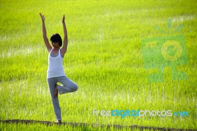 Girl Practicing Yoga Stock Photo
