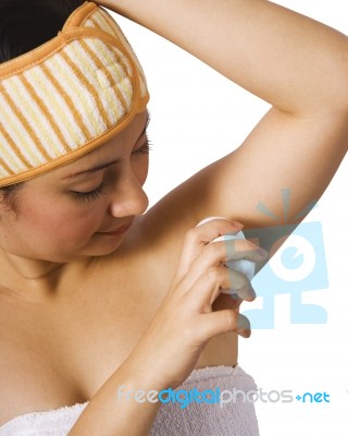 Girl Putting Underarm Deodorant Stock Photo