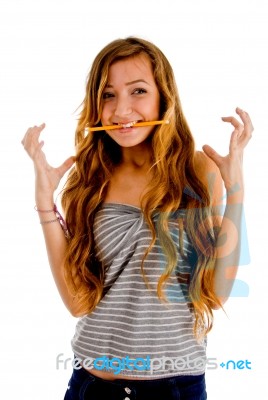 Girl Showing Gesture With Pencil Stock Photo
