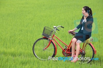 Girl Speaking In Field Stock Photo