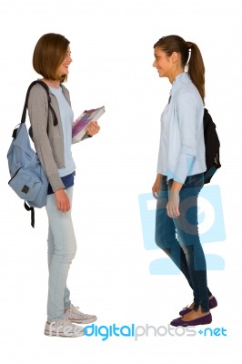 Girl Students Holding Books And Bag Stock Photo
