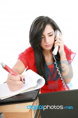 Girl Using Phone and Writing Stock Photo
