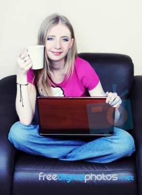 Girl With Laptop And Mug Stock Photo