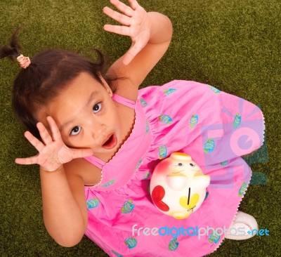 Girl With Piggy Bank Stock Photo