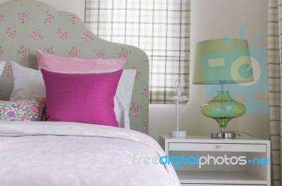 Girl's Bedroom With Pink Pillow On Green Bed Stock Photo