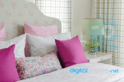 Girl's Bedroom With Pink Pillow On Green Bed Stock Photo