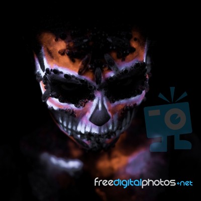 Girl's Face Painted Uv Skull Stock Photo