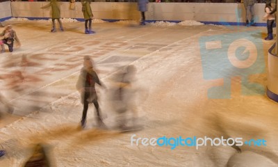 Girls Skating On The Ice Rink Stock Photo