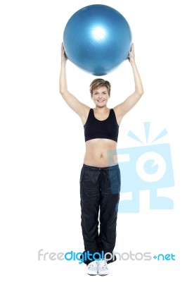 Glamorous Woman Doing Pilates Exercise Stock Photo