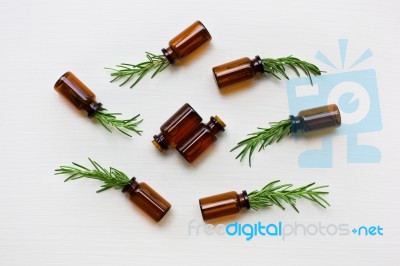 Glass Bottle Of Essential Oil  With Rosemary Stock Photo