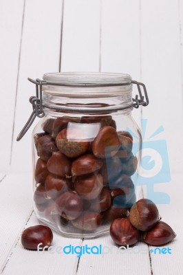 Glass Jar Full Of Chestnuts Stock Photo