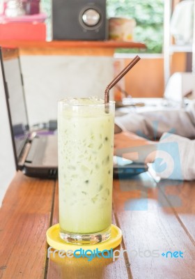 Glass Of Iced Green Tea Latte Stock Photo