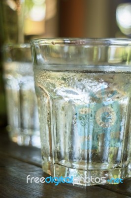 Glass Of Melt Iced Water Stock Photo