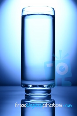 Glass Of Water Spot Light Blue Stock Photo