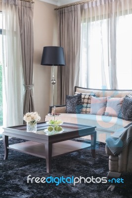 Glass Vase Of Flower On Wooden Table In Living Room Stock Photo