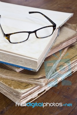 Glasses On Old Books Stock Photo