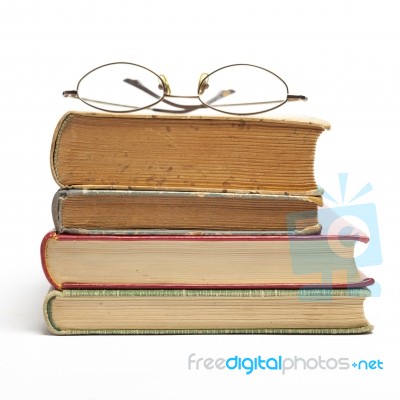 Glasses on Old Books Stock Photo