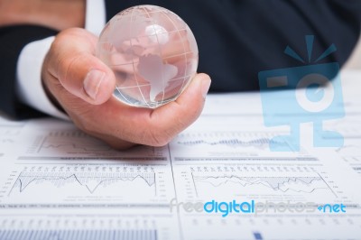 Globe With Chart Papers Stock Photo