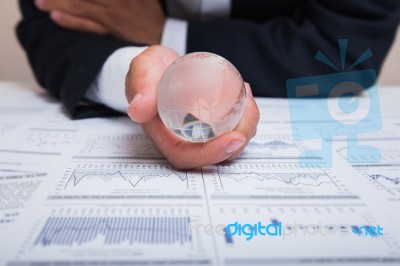 Globe With Chart Papers Stock Photo