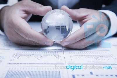 Globe With Chart Papers Stock Photo