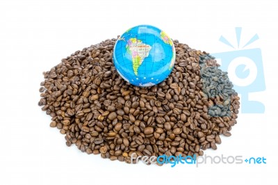 Globe With World On Heap Of Whole Coffee Beans Stock Photo