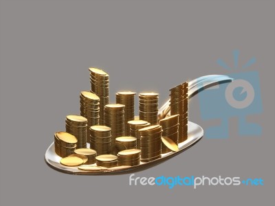 Gold Coins On A Silver Spoon Stock Image