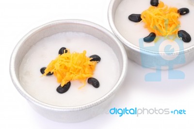 Gold Egg Yolk Threads And Black Bean Top Coconut Sticky Rice Cups On White Floor Stock Photo