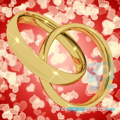 Gold Rings On Heart Background Stock Image