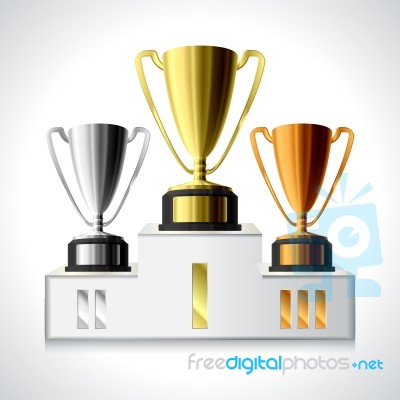 Gold, Silver And Bronze Trophy Cups On Pedestal Stock Image