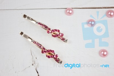 Golden Hairpins With Pink Gemstone And Pink Pearls On White Wood… Stock Photo