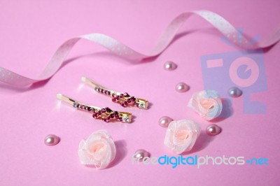 Golden Hairpins With Pink Gemstone On Pink Background Stock Photo