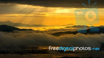 Golden Light At Mountains Is Covered By Morning Fog And Sunrise In Seoul,korea Stock Photo