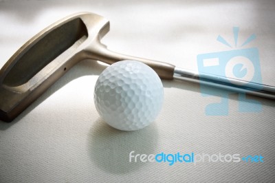 Golf Ball And Putter Stock Photo