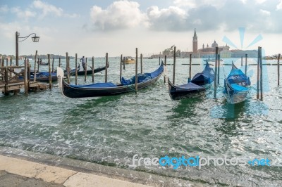Gondolas Moored At The Entrance To The Grand Canal Stock Photo
