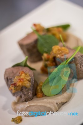 Gourmet Dish With Lamb And Spinach Stock Photo