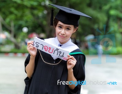 Graduation Asian Girls With Congratulation In Thai Wording Stock Photo