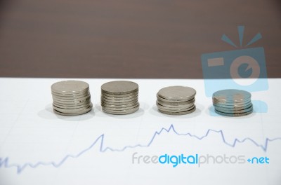 Graph And Coin Stock Photo