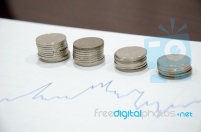 Graph And Coin Stock Photo