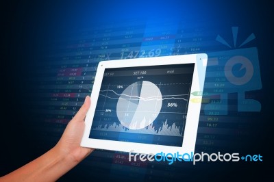 Graph Report From Tablet For Financial Stock Photo