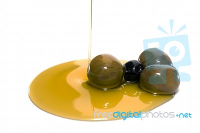 Green And Black Olives With Olive Oil Stock Photo
