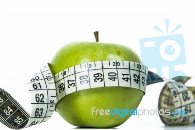 Green Apple And Measuring Tape Stock Photo
