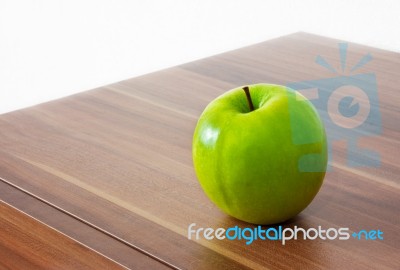 Green Apple On The Table Stock Photo