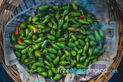 Green Chili Peppers In A Basket Stock Photo