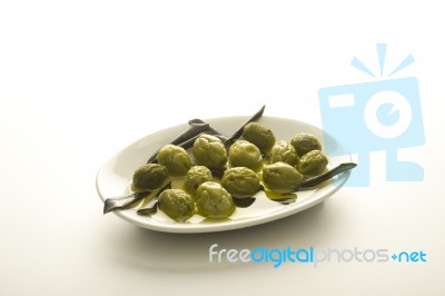 Green Olives In Olive Oil Stock Photo