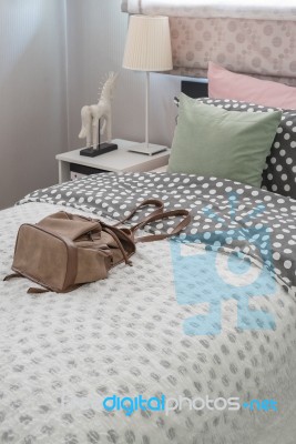 Green Pillow On Kid's Bedroom With Brown Bag Stock Photo