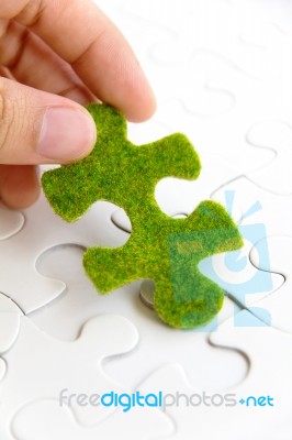 Green Puzzle Piece Stock Photo