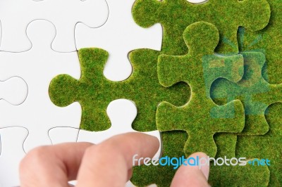 Green Puzzle Piece Stock Photo