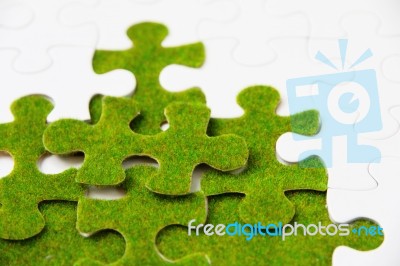 Green Puzzle Piece Concept Stock Photo