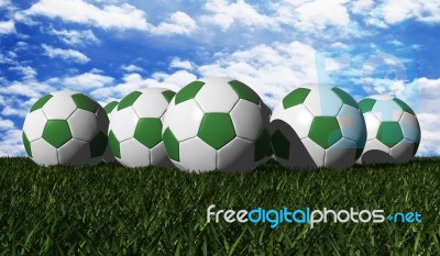 Green Soccer Balls On Grass Stock Image